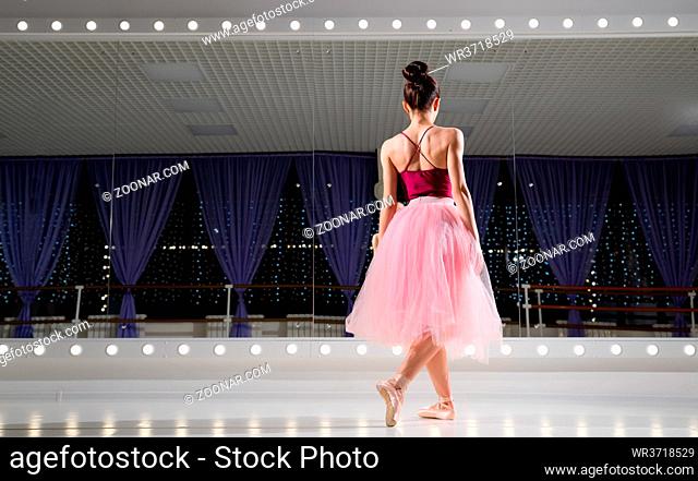 Young ballerina in training hall