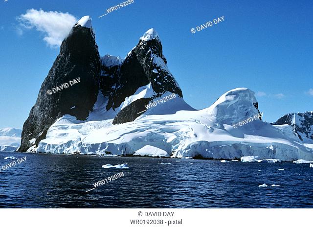 The famous ice capped 'Una's Tits' peaks at Cape Renard Cape Renard , Antarctica