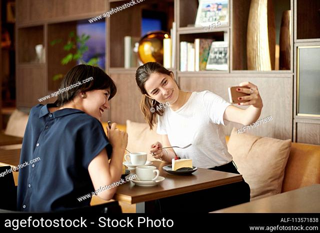Young girlfriends at a cafe