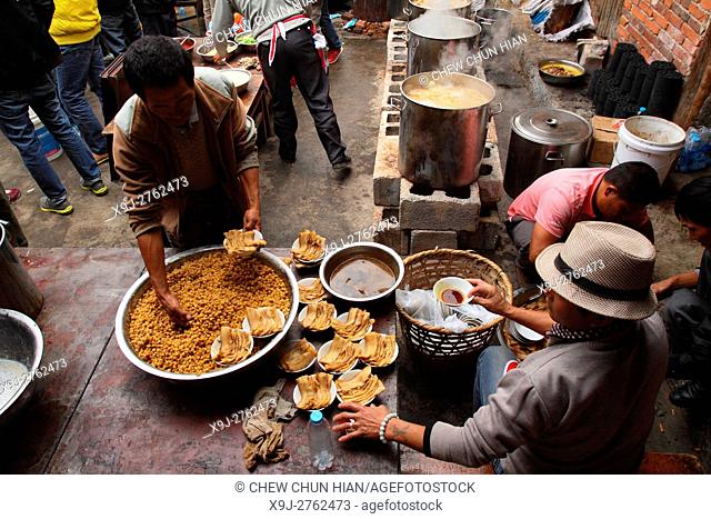 Preparing food, Bei People's Village in Dali, Yunnan Province, China