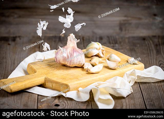 Still life with garlics on rustic wood table