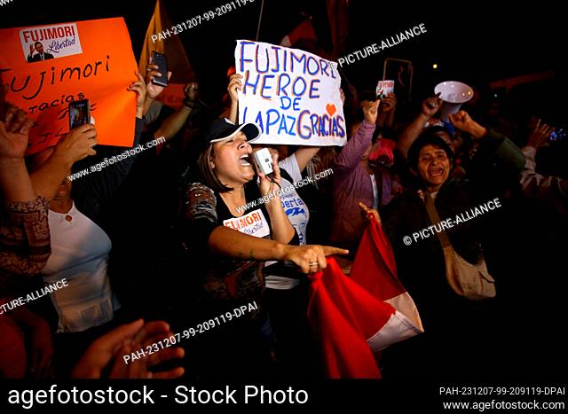 06 December 2023, Peru, Lima: People linger at the home of former Peruvian President Fujimori's daughter after Fujimori was released from prison