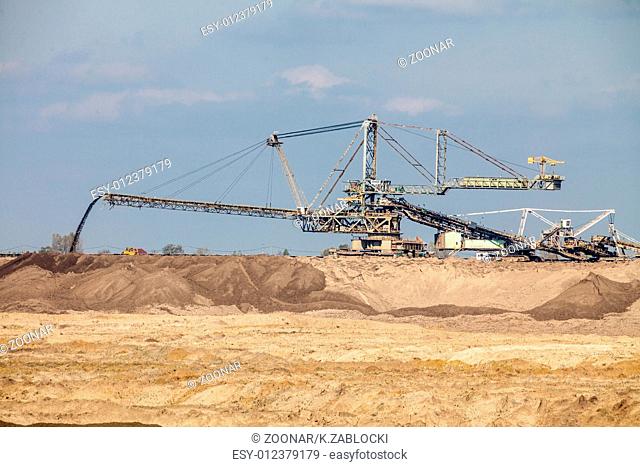 Opencast brown coal mine. Giant excavator