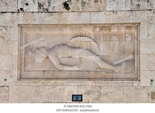 Tomb of the unknown soldier marble sculpture of dying ancient greek hoplite warrior holding his shield and spear, Athens Greece