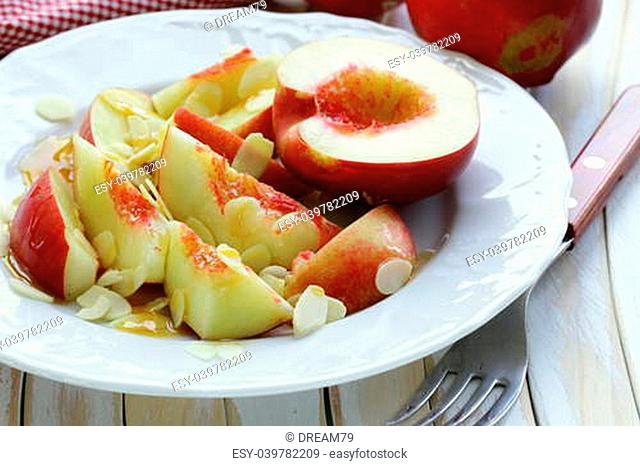 Summer fruit dessert with peaches, almonds and honey