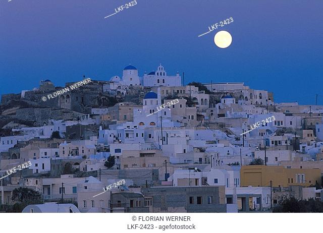 Town on a hill at moonrise, Pyrgos, Santorin, Greece