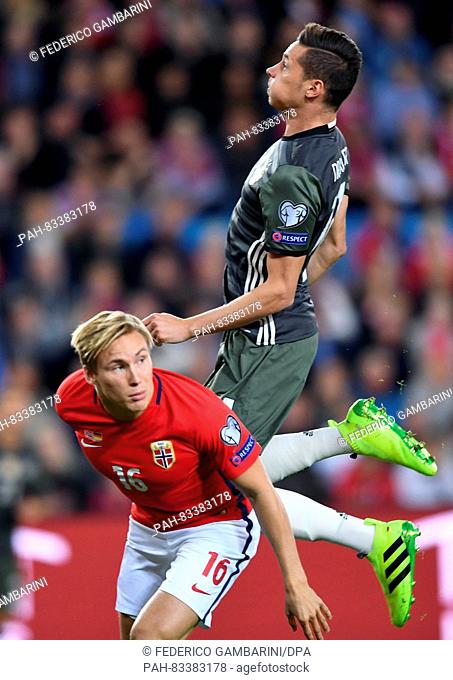 Julian Draxler (top) of Germany and Jonas Svensson of Norway in action during the FIFA World Cup Qualifiers Europe Group C soccer match between Norway and...