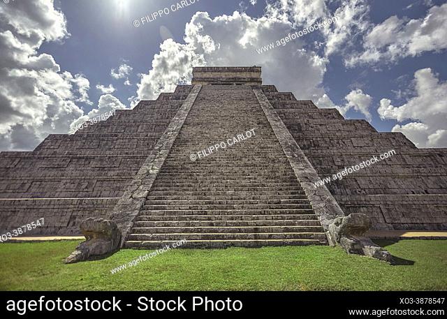 Front view of the staircase and decorations of the Pyramid of the Chichen Itza archaeological complex