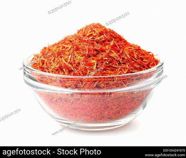 Glass bowl of saffron threads isolated on white