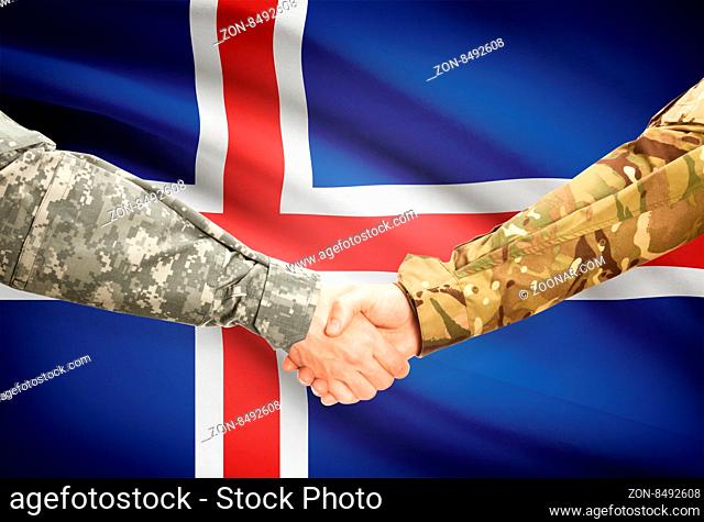 Soldiers shaking hands with flag on background - Iceland