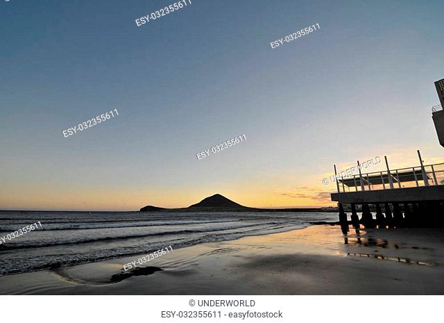 Sunset on the Atlantic Ocean with a Mountain in Background El Medano Tenerife Canary Islands Spain