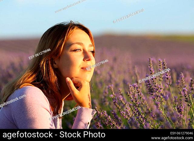 Relaxed woman contemplating lavender field
