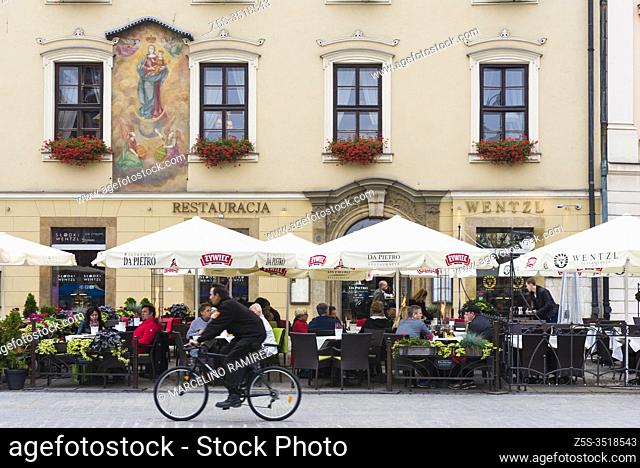 Terrace of the Wentzl restaurant and coffee shop, on the painted facade the image of the Black Madonna of Czestochowa also known as Our Lady of Czestochowa