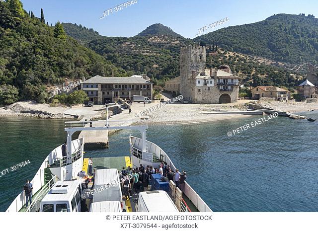 The ferry from Ouranoupoli approaching the landing point for Zografou Monastery on the Southwest coast of the Athos peninsula, Macedonia, Northern Greece