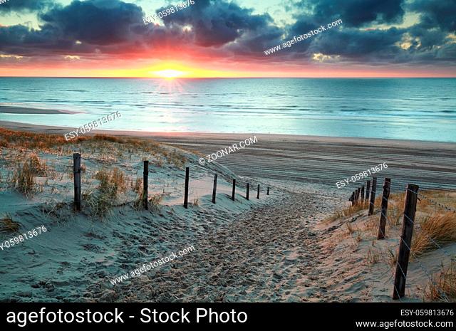 sunshine on sand path to sand beach, Holland