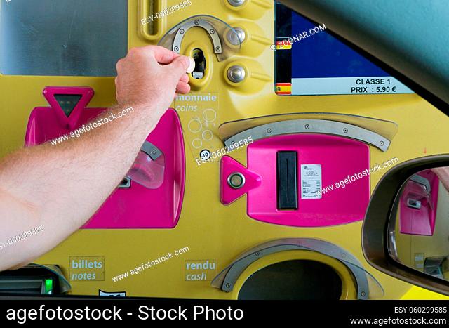 Rouen, Seine-Maritimne / France - 12 August 2019: man paying toll at an automatic toll booth station on a French highway close up view