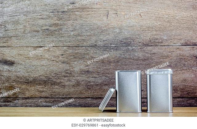 An aluminum Box top on wooden background