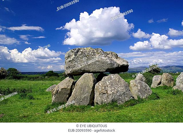 Carrowmore Megalithic Cemetery. A dolmen under blue sky and white cloud