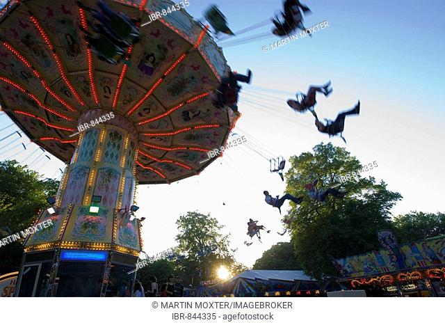 Chair-O-Planes or swing carousel amusement ride at the traditional Waeldchestag celebration, Frankfurt, Hesse, Germany, Europe