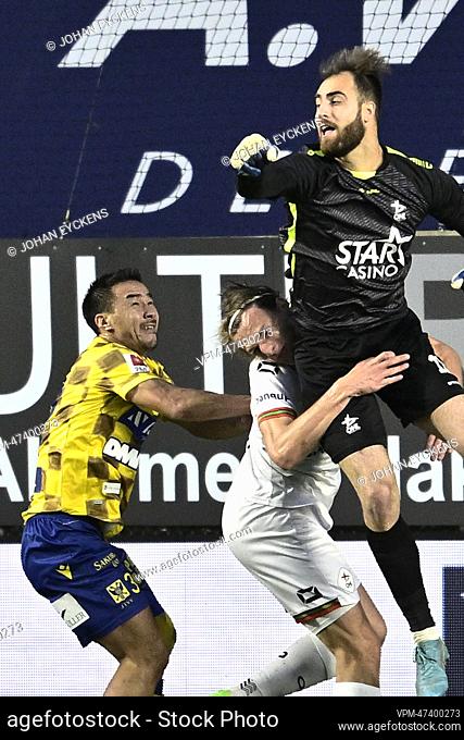 STVV's Shinji Okazaki, OHL's Ewoud Pletinckx and OHL's goalkeeper Valentin Cojocaru fight for the ball during a soccer match between Sint-Truidense VV and OH...