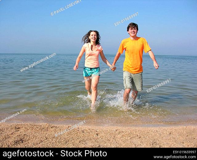 couple run on beach
