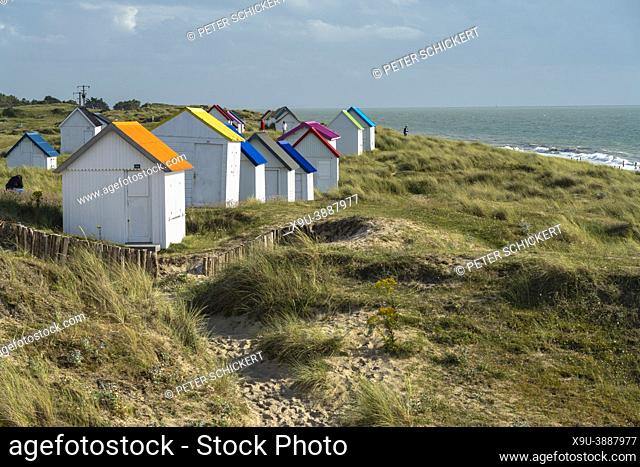 Colorful beach houses in the dunes on the beach at Gouville-sur-Mer, Normandy, France