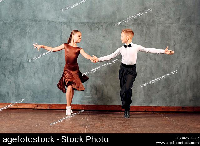 Young dancers boy and girl dancing in ballroom dance Samba