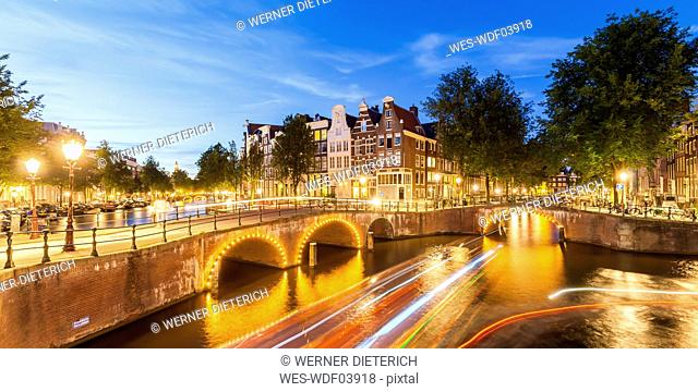 Netherlands, Amsterdam, lighted bridges over Emperor's Canal and Leidse Canal in the evening
