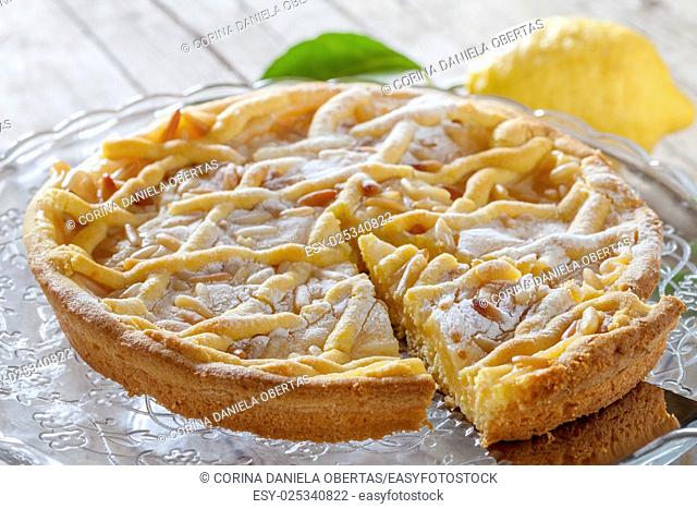 Grandmas cake, typical cake from Tuscany, Italy, made with shortbread pastry, ricotta cheese and pine nuts