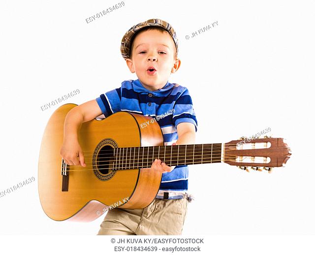 Child, 5 years old, plays guitar with emotion, white background