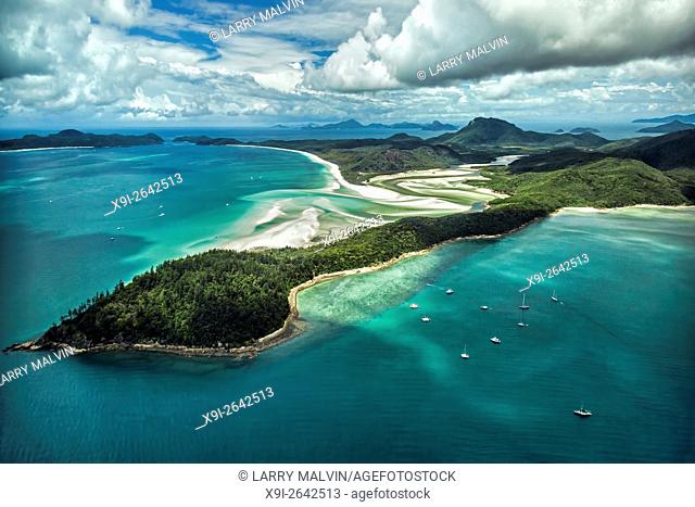 Aerial view from Hill Inlet of the waters and swirling sands of Whitsunday Island with Whitehaven Beach in the distance in Queensland, Australia