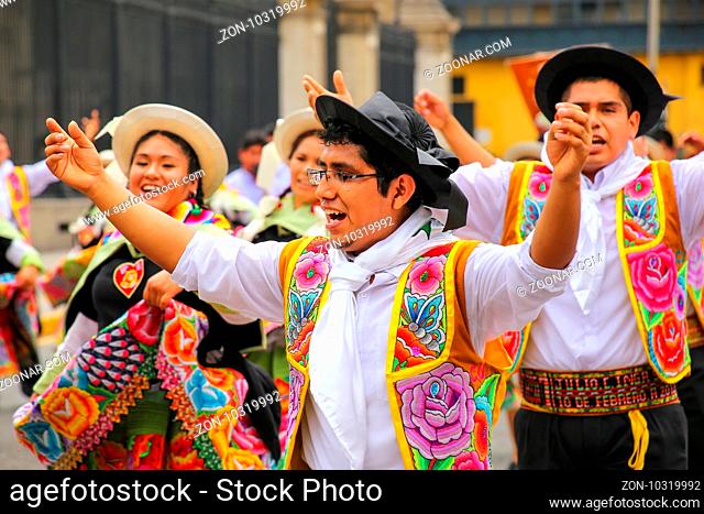 Local men dancing during Festival of the Virgin de la Candelaria in Lima, Peru. The core of the festival is dancing and music performed by different dance...