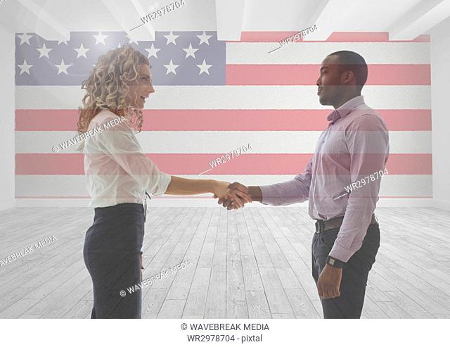 Business people shaking their hands against american flag