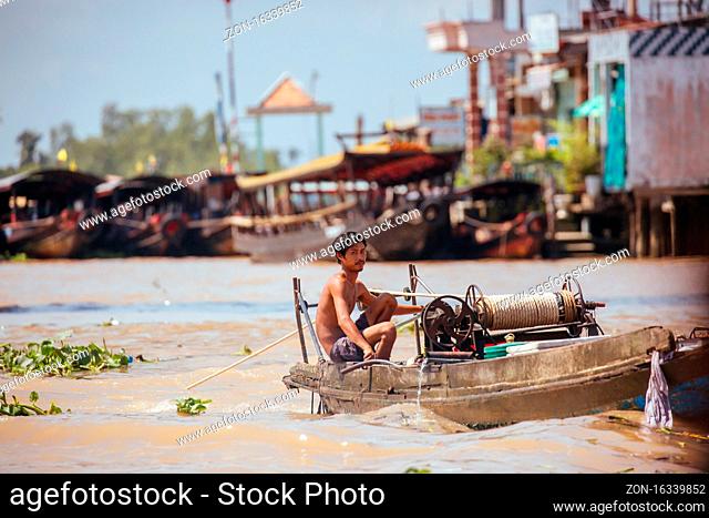Mekong Delta, Vietnam - September 29, 2018: Unidentified Vietnamese person travelling by boat whilst working their job on the Mekong River in Vietnam