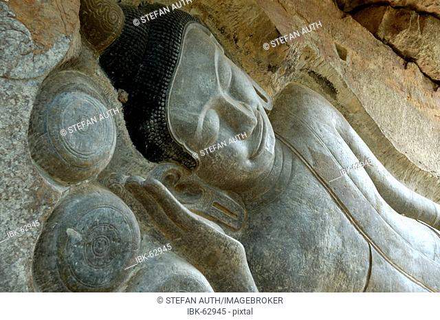 Stone image of reclining Buddha Phnom Santuk near Kompong Thom Cambodia