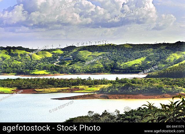 West shore of Lake Arenal with new hotel and wind turbines, Alajuela Province, Costa Rica, Central America