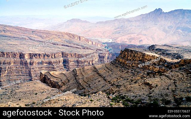 Scenic view of Wadi Ghul aka Grand Canyon of Arabia and surrounding landscape in Jebel Shams, Oman