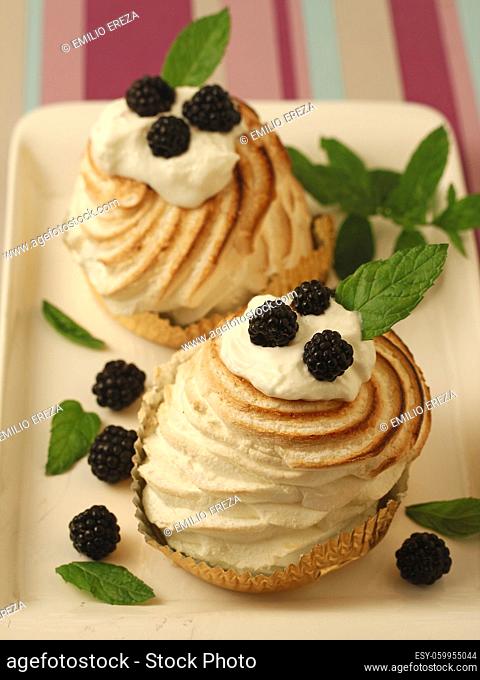 Meringues with cream and blackberries
