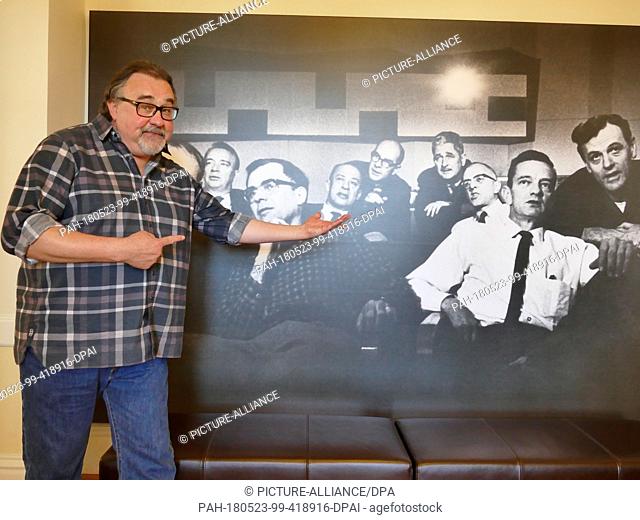 16 May 2018, US, San Francisco: Don Hahn stands in front of a photo of nine legendary Disney artists, also known as the 'Nine Old Men'