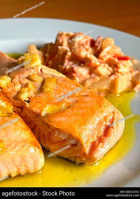 Salmon loin with garlic and seafood salad