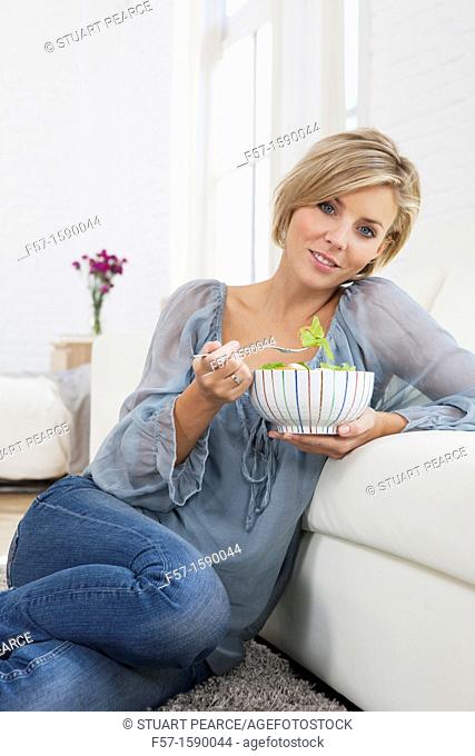 Young woman having a salad for lunch