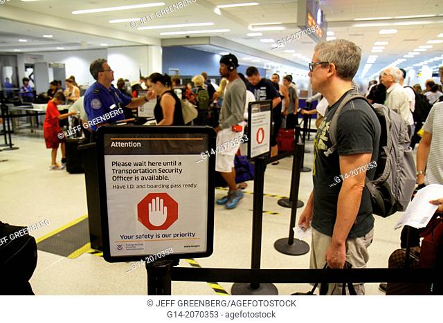 Florida, Miami, Miami International Airport, MIA, terminal, TSA, security, screening, line, queue, man, waiting,