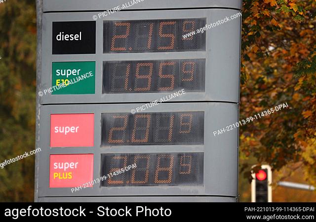 13 October 2022, Deutschland, Kaufbeuren: Prices for diesel and gasoline are displayed on a board in front of a gas station