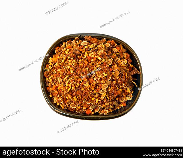 A mixture of seasonings in a bowl isolated on a white background. Spice on isolate. View from above