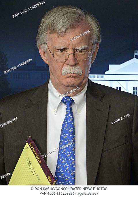 National Security Advisor John R. Bolton holds a yellow pad with his notes visible as he conducts a briefing in the Brady Press Briefing Room of the White House...