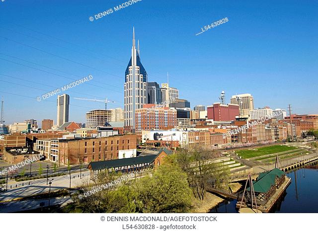Cityscape Skyline of Downtown Nashville Tennessee with view of Cumberland River taken from the Shelby Street pedestrian bridge. USA