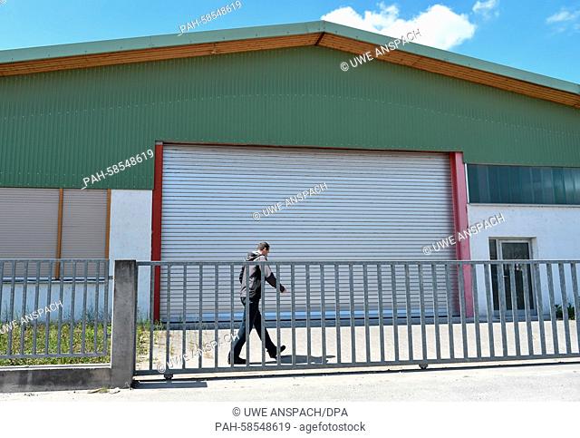 A man goes into a storage unit, in which Nazi art works were allegedly stored, in a commercial zone in Bad Duerkheim, Germany, 21 May 2015