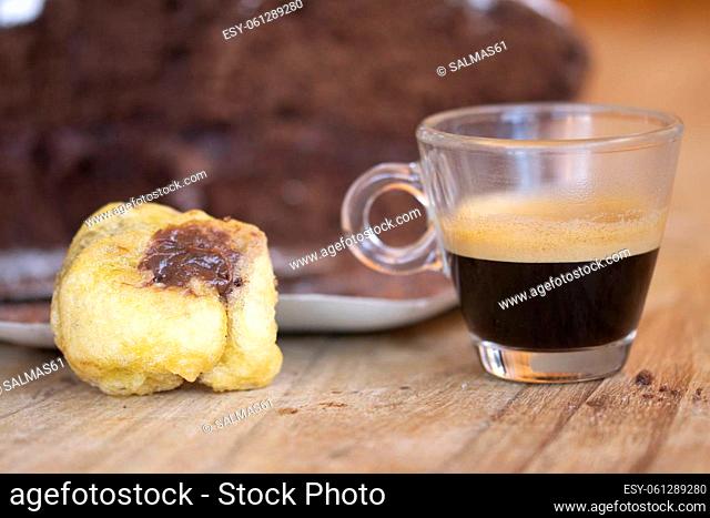 breakfast with espresso coffee and chocolate cream puff