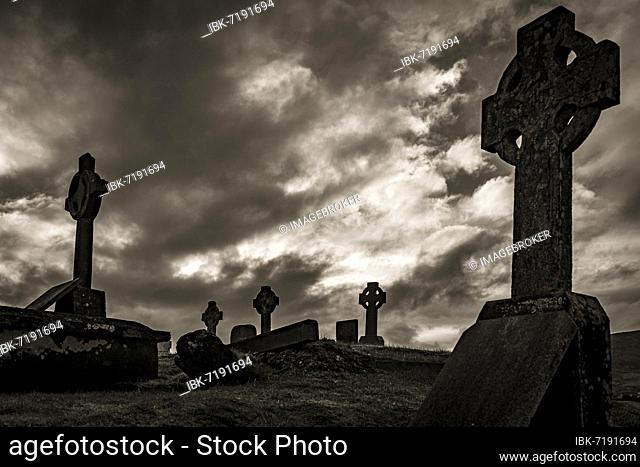 Black and white, Creepy old grave crosses with cloudy sky, Dingle Peninsula, Kerry, Ireland, Europe