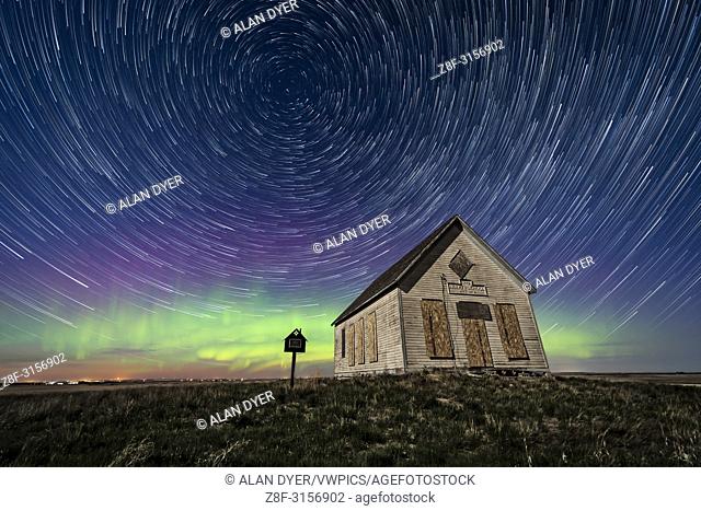 The 1910 Liberty Schoolhouse, a classic pioneer one-room school, on the Alberta prairie under the stars on a spring night
